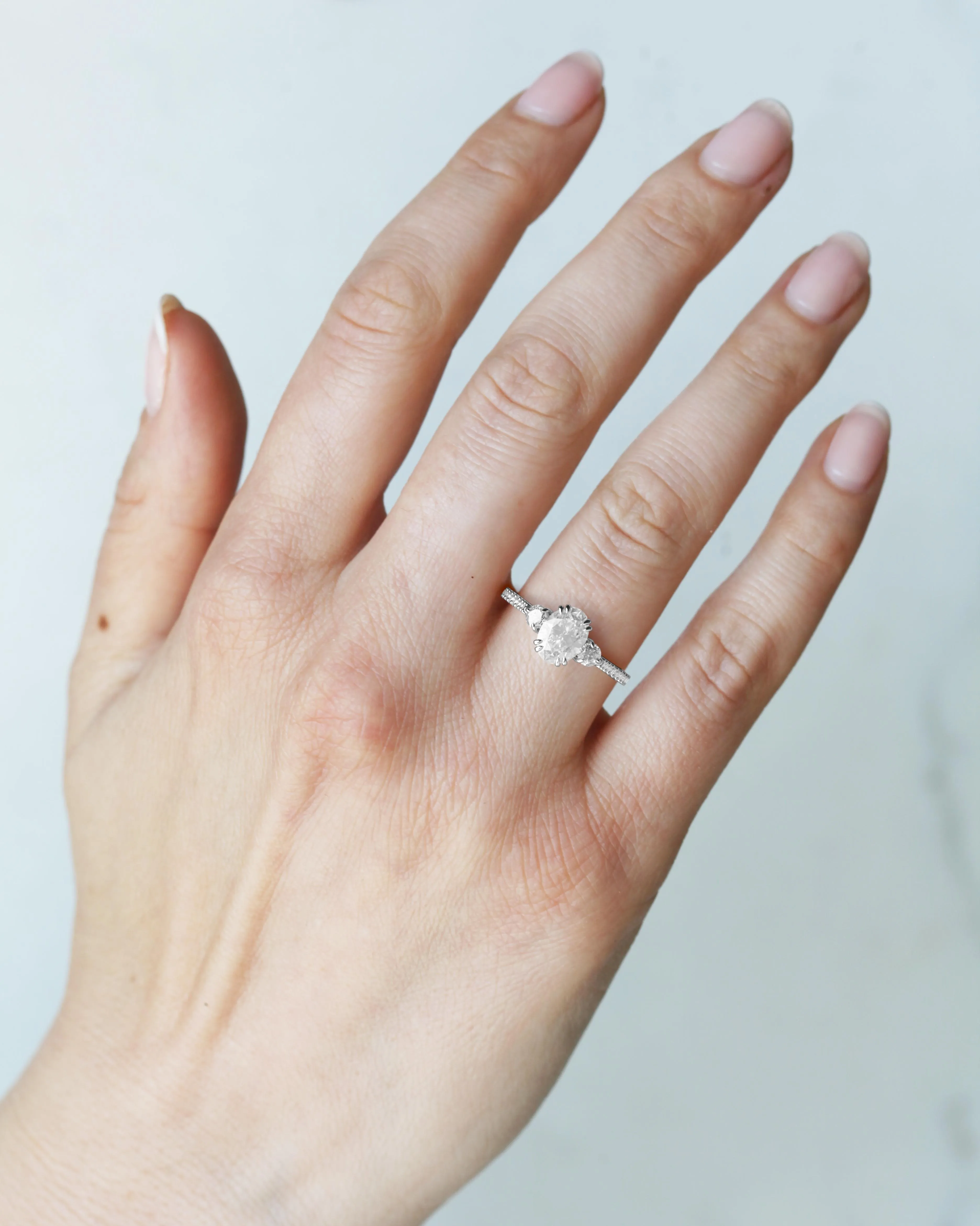 Oval Half Pave Diamond Ring With Accent Stones