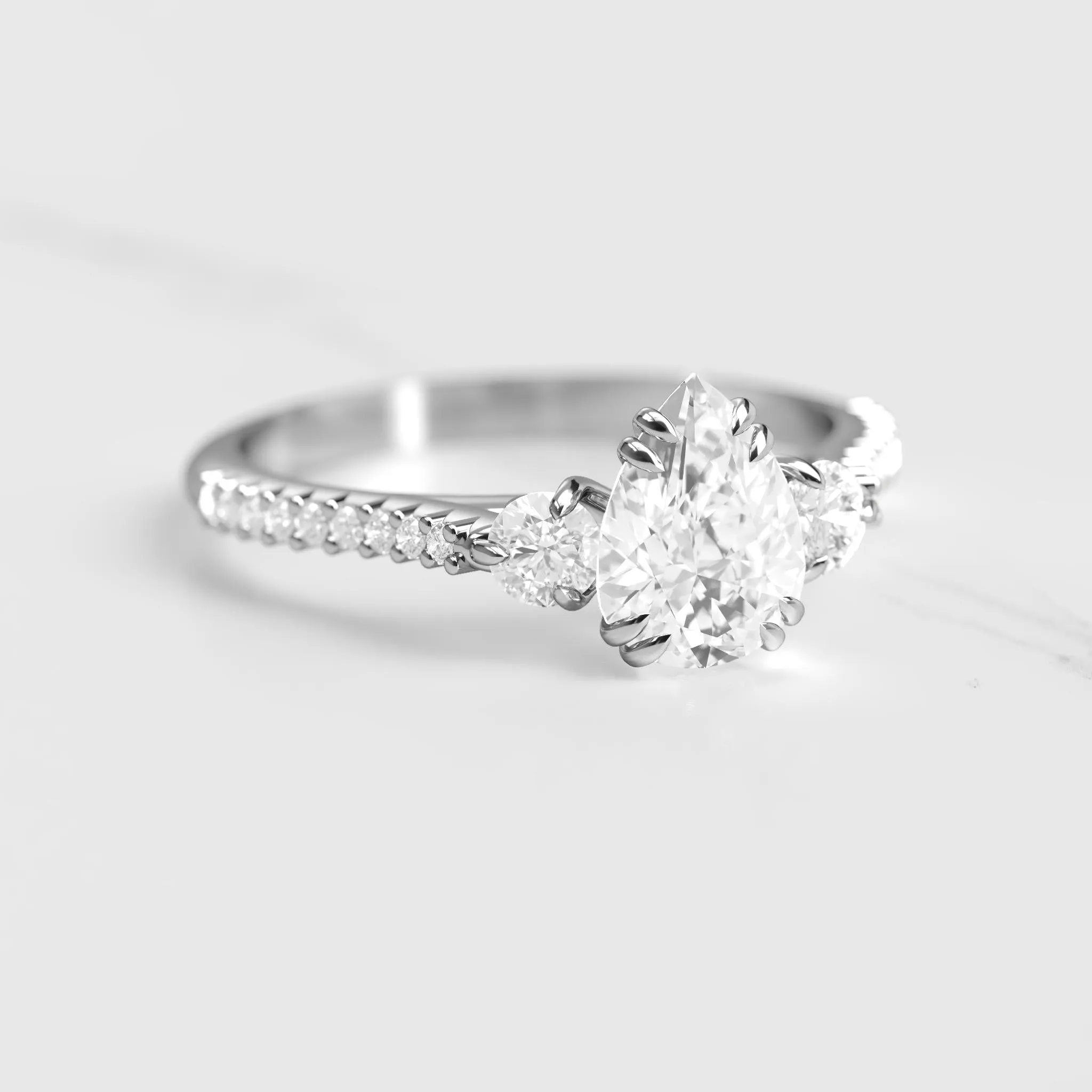 Pear Half Pave Diamond Ring With Accent Stones